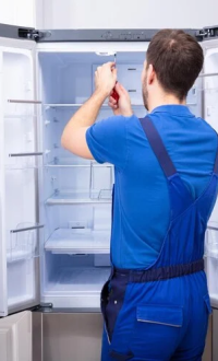 repairman-fixing-refrigerator-wi